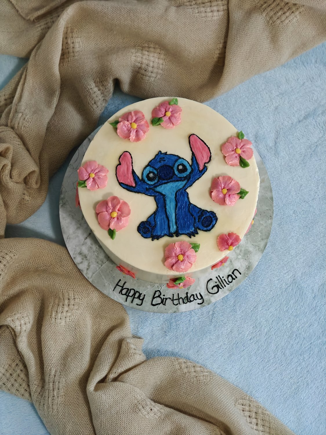 Lilo and Stitch birthday cake — hand-painted Stitch in vibrant blue